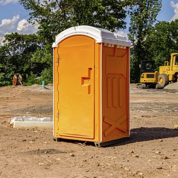 what is the cost difference between standard and deluxe portable toilet rentals in Clay